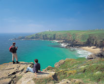 A couple walking near the Cornish Coast